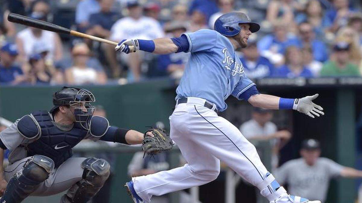 
The Royals' Alex Gordon follows through on a single in front of Mariners catcher Mike Zunino (3) during Sunday's baseball game at Kauffman Stadium.
