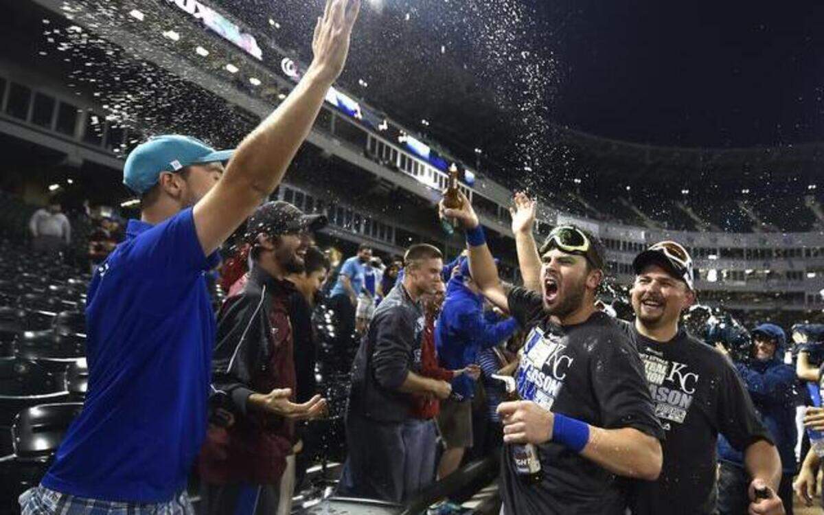 
Kansas City Royals' Mike Moustakas and Billy Butler celebrate with fans following their clinching of a wild-card spot in the playoffs following Friday's baseball game against the Chicago White Sox on September 26, 2014 at U.S. Cellular Field in Chicago, Ill.
