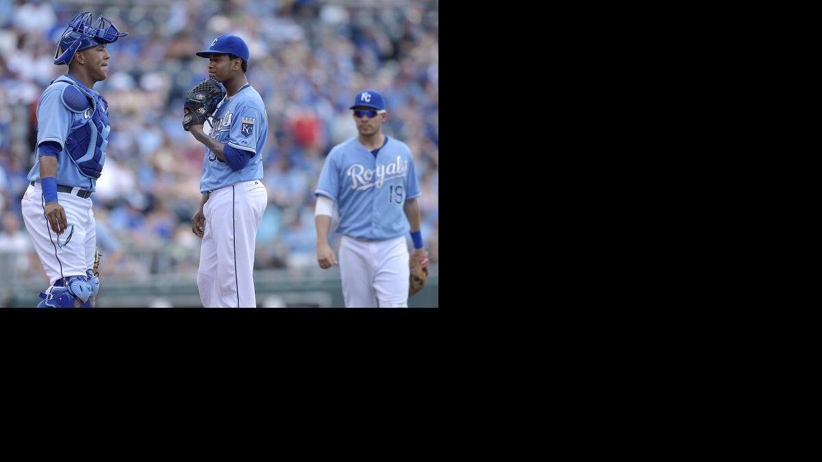 Starting pitcher Yordano Ventura (30) and catcher Salvador Perez (13) are examples of the Royals' success in the international market.
