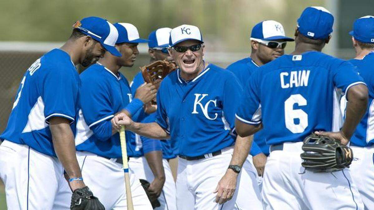 
Kansas City Royals first base coach Rusty Kuntz joked with the players during spring training a year ago.
