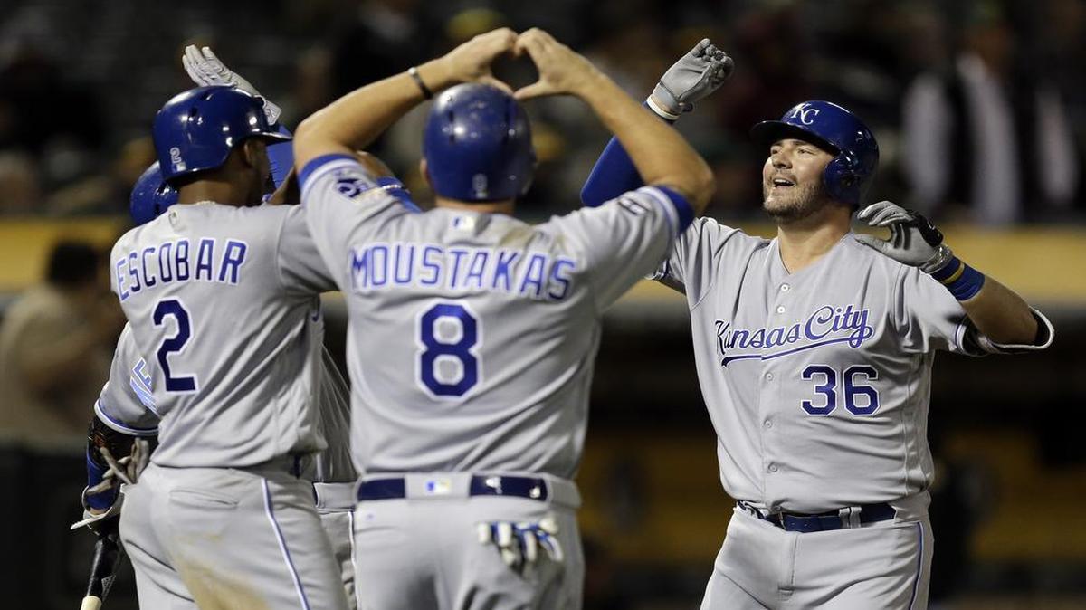 Royals rookie catcher Cam Gallagher (right) was greeted by Alcides Escobar (left) and Mike Moustakas after Gallagher’s grand slam in the sixth inning of Monday’s game against the A’s in Oakland, Calif.