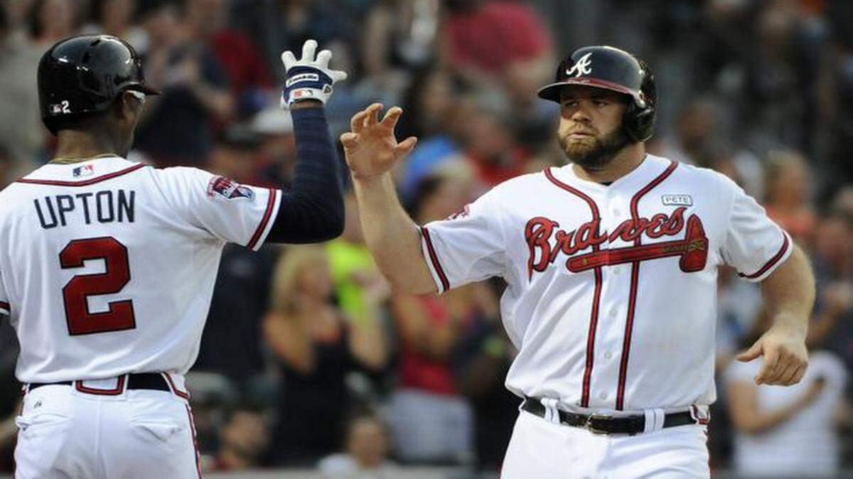 
Evan Gattis (right) reportedly is an impact bat the Royals have their eye on.



