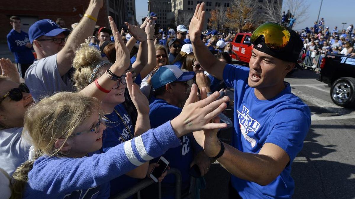 Royals pitcher Jeremy Guthrie high-fived people along the parade route at 9th and Oak Streets on Tuesday, Nov. 3, 2015, as the World Series parade moved through downtown Kansas City.