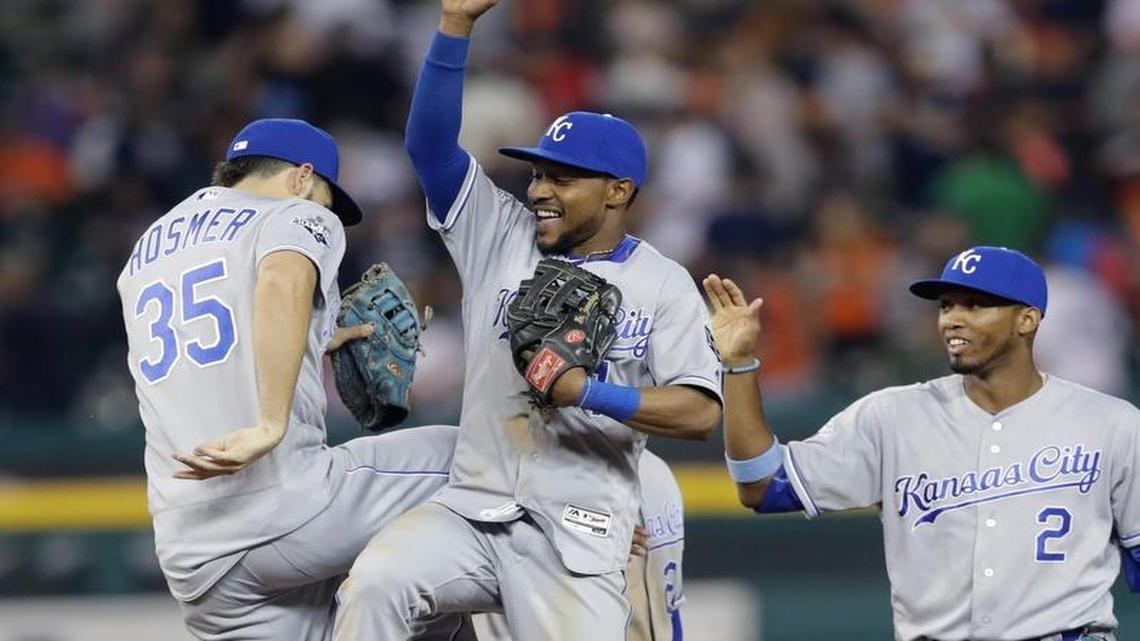 Kansas City Royals center fielder Jarrod Dyson, center, high-fives teammate Eric Hosmer (35) after the Royals defeated the Detroit Tigers, 8-4 in a baseball game, Saturday, July 16, 2016 in Detroit.