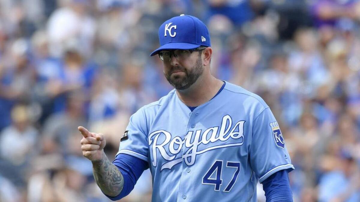 Kansas City Royals relief pitcher Peter Moylan points to catcher Drew Butera after ending the top of the seventh with a double play on the Colorado Rockies during Thursday’s baseball game at Kauffman Stadium in Kansas City, Mo.