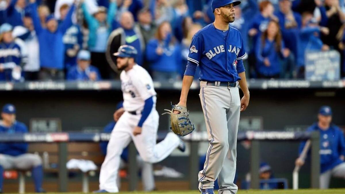 
Blue Jays pitcher David Price shows his displeasure as Royals third baseman Mike Moustakas heads for home on Alex Gordon’s double in the seventh inning Saturday.
