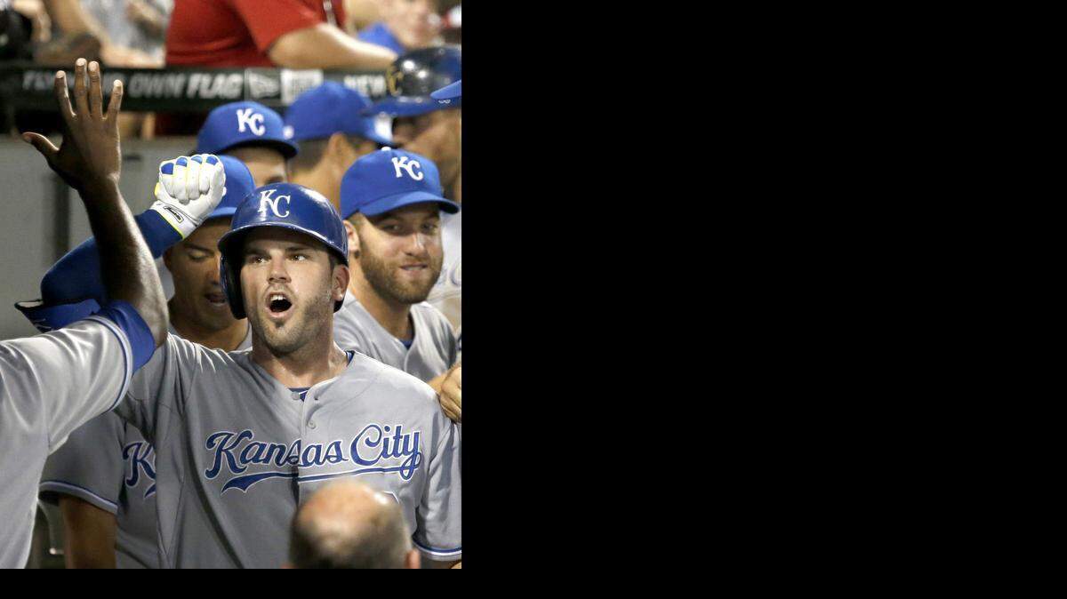 The Royals' Mike Moustakas celebrated his two-run home run off White Sox relief pitcher Eric Surkamp, which also scored Alex Gordon, in the eighth inning Tuesday night in Chicago. The Royals won the game 7-1.