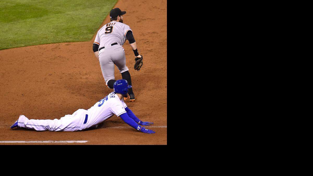 Eric Hosmer was called out after sliding headfirst into first in the third as the Giants turned a double play.