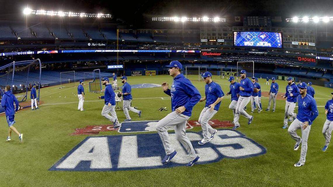 Royals pitcher Chris Young joins teammates in running to warm up before Monday's ALCS baseball game against the Blue Jays in Toronto.
