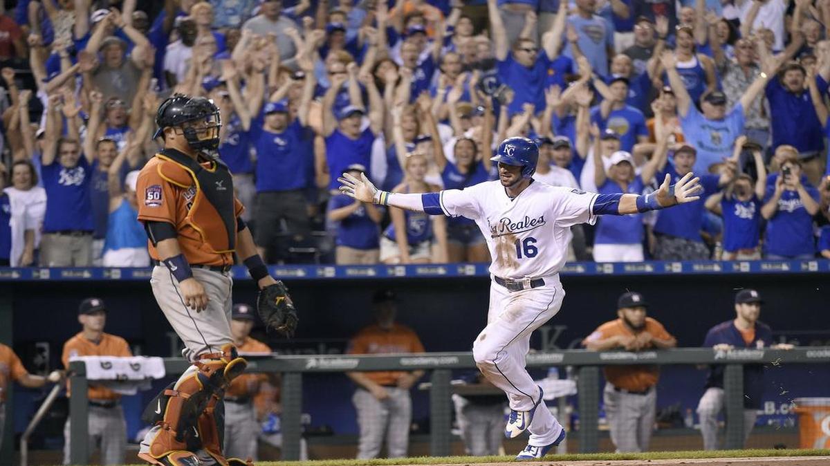 
The Royals’ Paulo Orlando scored the winning run in front of Houston Astros catcher Hank Conger on a single by Alcides Escobar in the 10th inning for a 2-1 win on July 25, 2015, at Kauffman Stadium.
