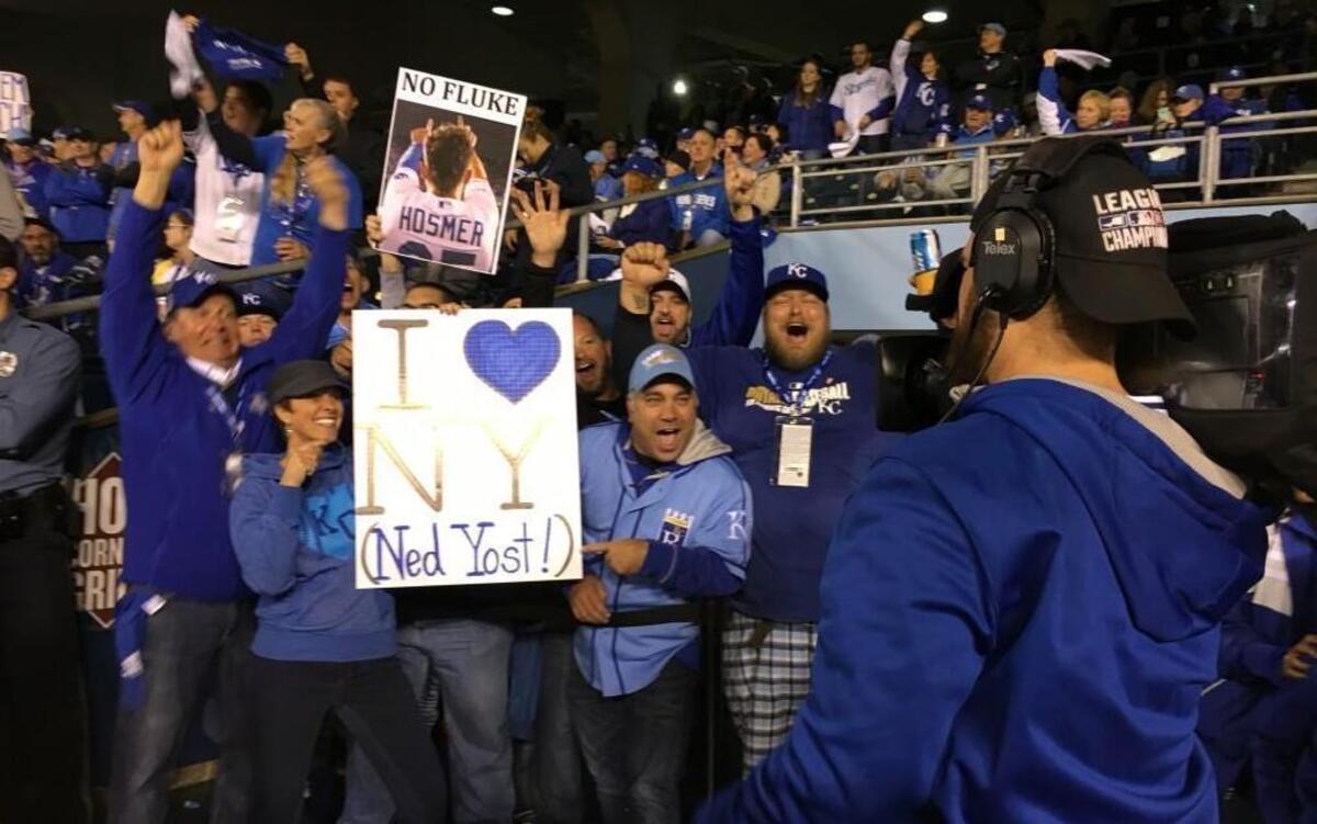 Crown Vision cameraman James Moore enjoys putting creative signs up on the big video board in Kauffman Stadium. On Tuesday, he shot Carrie Bachmeier’s Ned Yost sign surrounded by other energetic fans.