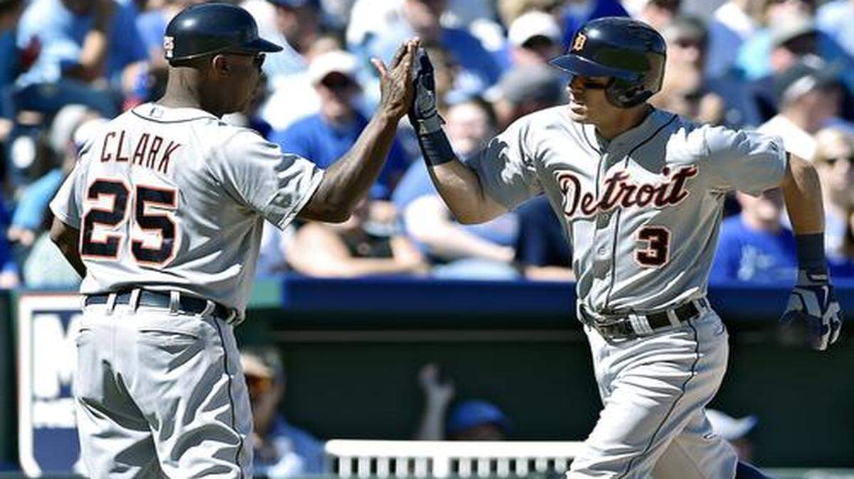 
The Tigers’ Ian Kinsler was congratulated by third base coach Dave Clark after hitting a solo home run on Sunday.
