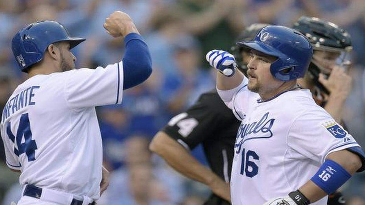 
The Royals' Omar Infante (14) congratulates Billy Butler at the plate after Butler hit a two-run homer in the first inning of Friday's baseball game against the Giants at Kauffman Stadium.
