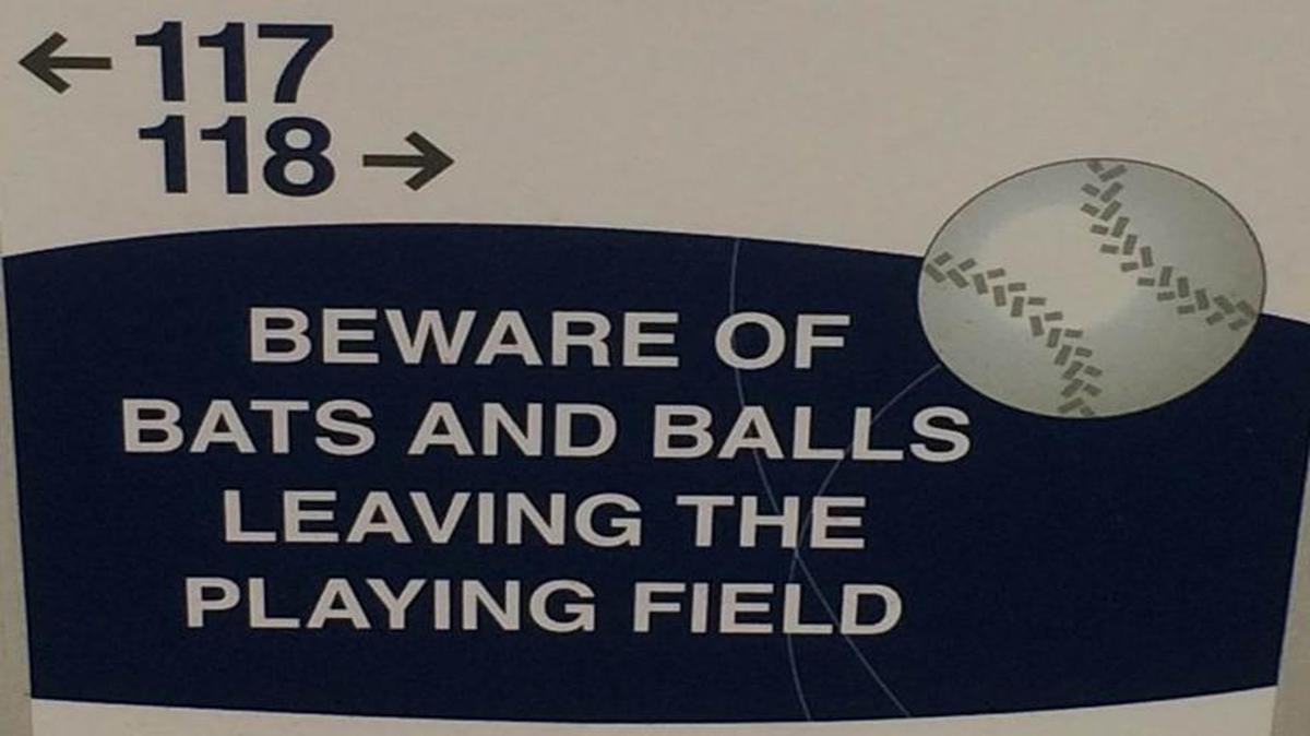 
Signs like this are posted on seats near the field of play at Kauffman Stadium, offering a stern reminder to those sitting closest to the action.
