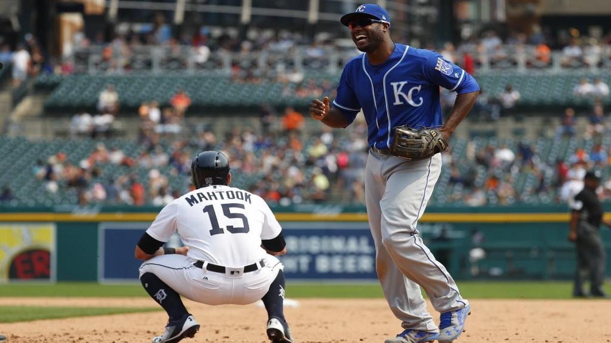 Kansas City Royals center fielder Lorenzo Cain laughed as he ran to the dugout past Detroit’s Mikie Mahtook after Alex Gordon had robbed Mahtook of a homer during Monday’s game.