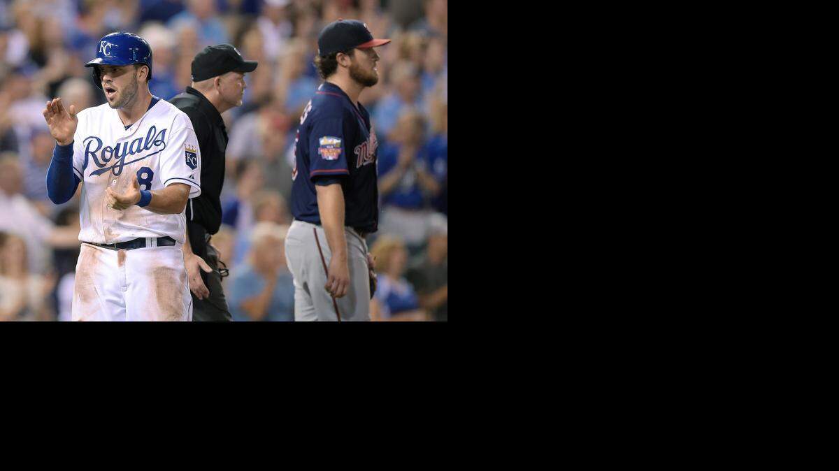 
The Royals’ Mike Moustakas celebrated after scoring the go-ahead run on a double by Nori Aoki in the eighth inning as Minnesota Twins starter Phil Hughes walked back to the mound Wednesday night at Kauffman Stadium. The Royals scored four more runs in the inning and went on to win 6-1.
