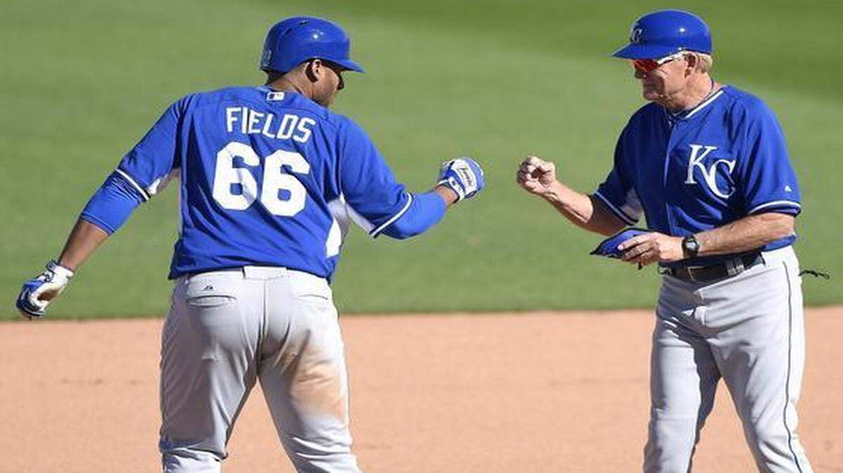 
Matt Fields was congratulated by Royals first-base coach Rusty Kuntz after hitting a double in the eighth inning of a spring training game against the Texas Rangers on March 4 in Surprise, Ariz.
