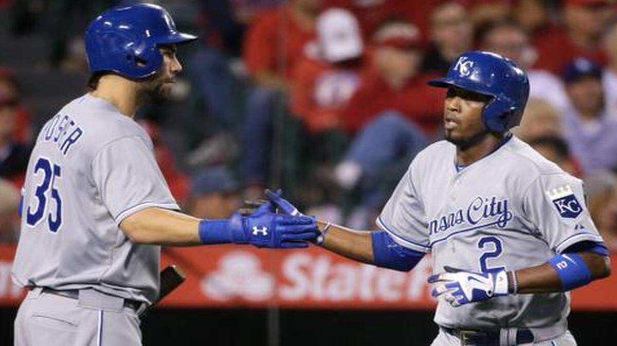 
Eric Hosmer congratulated Royals teammate Alcides Escobar after Escobar scored on a single by Lorenzo Cain in the fifth inning against the Los Angeles Angels of Anaheim on Friday night in Anaheim, Calif.
