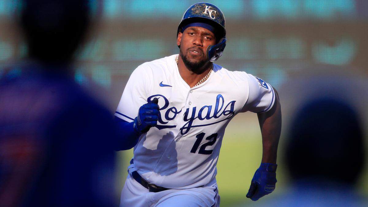 Kansas City Royals’ Jorge Soler (12) runs from first base to third base on a single by teammate Salvador Perez during the first inning of a baseball game against the Chicago Cubs at Kauffman Stadium in Kansas City, Mo., Thursday, Aug. 6, 2020.