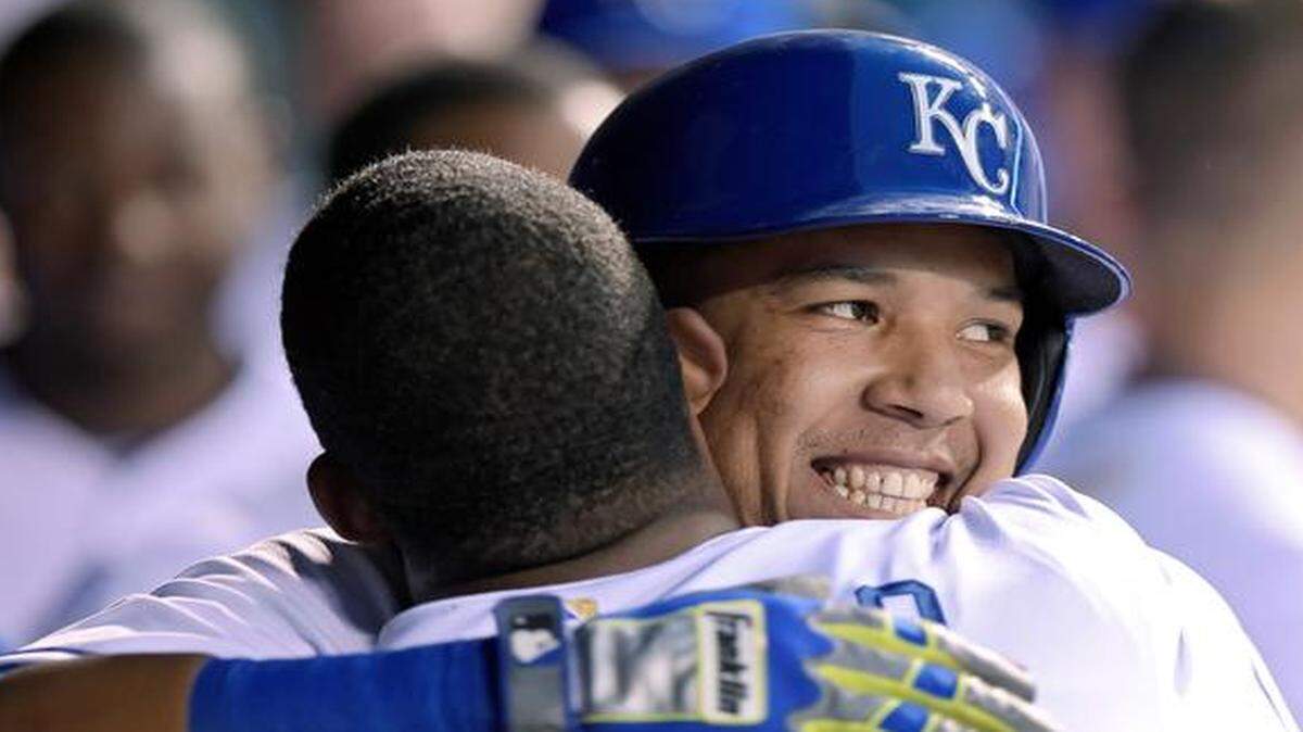 
The Royals' Salvador Perez gets a hug from Carlos Peguero after Perez hit a two-run homer in the third inning of Monday's baseball game against the Texas Rangers at Kauffman Stadium.
