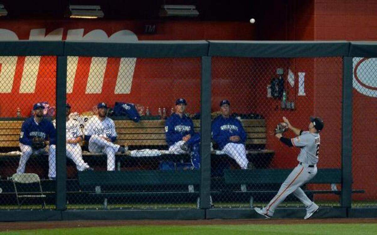 
San Francisco Giants left fielder Juan Perez watched as a ball hit by Kansas City’s Salvador Perez went over the fence in the seventh inning Tuesday, preventing the game from being a shutout for the Royals. 
