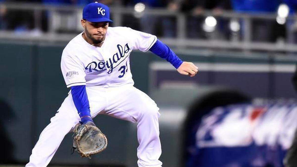 
Kansas City Royals first baseman Eric Hosmer (35) scoops up the ball to throw to first for an out in the first inning during Wednesday's Kansas City Royals and San Francisco Giants Game 7 of the World Series at Kauffman Stadium on Oct. 29, 2014 in Kansas City, Missouri.

