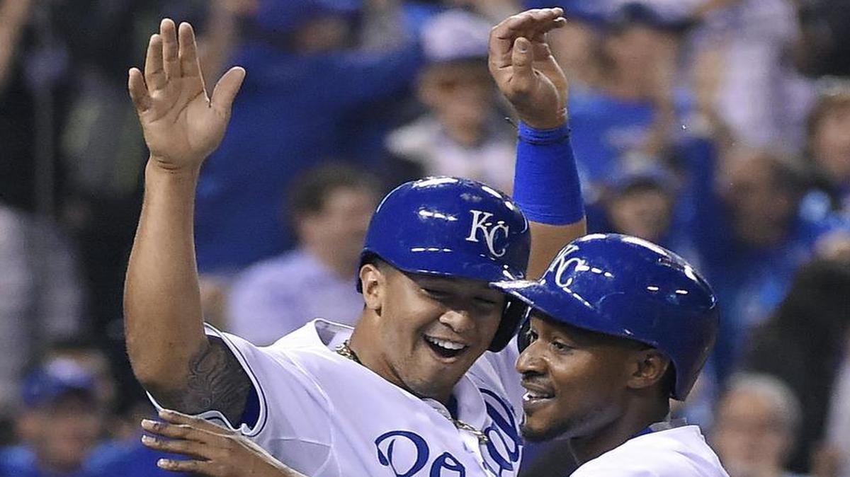 
The Royals’ Cheslor Cuthbert (19) and Jarrod Dyson celebrated after scoring on a three-run double by Alcides Escobar in the sixth inning of game two of a doubleheader against the Tampa Bay Rays on Tuesday night at Kauffman Stadium.
