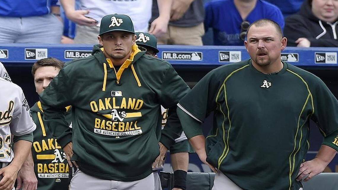 
Billy Butler (right) and his A’s teammates stood by the dugout after the Royals’ Kelvin Herrera was ejected for throwing a pitch behind Brett Lawrie in the eighth inning.
