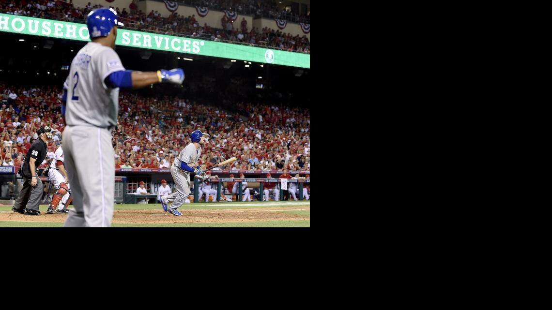 
Kansas City Royals' Alcides Escobar (2) begins to celebrate as Mike Moustakas (8) watches his eleventh inning solo home run leave the park during Friday's ALDS baseball game against the Los Angeles Angels on October 3, 2014 at Angels Stadium in Anaheim, Calif.
