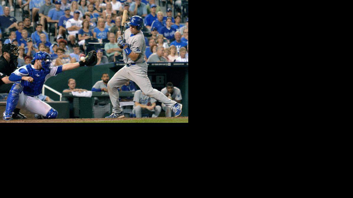 
Los Angeles Dodgers' A.J. Ellis (17) is hit by a pitch from Kansas City Royals relief pitcher Wade Davis (17) in the eighth inning with the bases loaded to score Andre Ethier during Wednesday's baseball game on June 25, 2014 at Kauffman Stadium in Kansas City, Mo.
