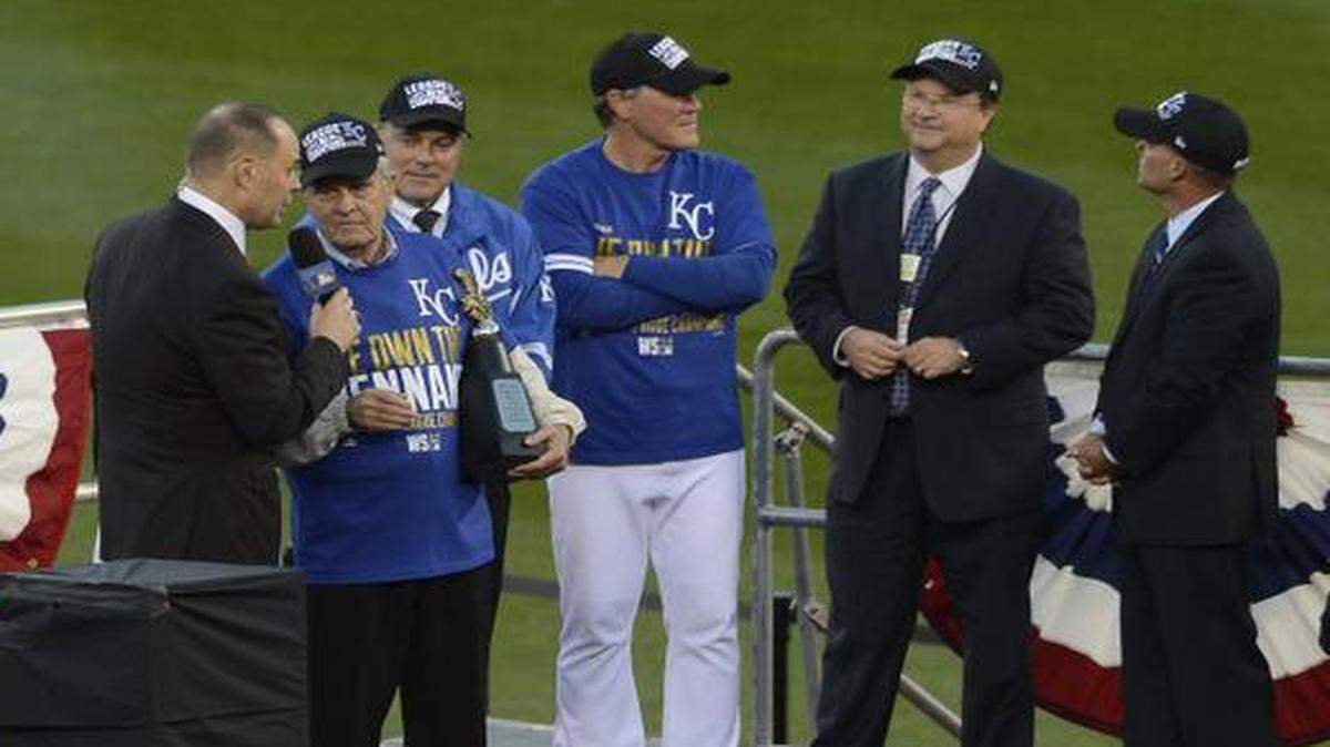 
Kansas City Royals owner David Glass held onto the American League championship trophy on Wednesday, Oct. 15, 2014 at Kauffman Stadium after the Royals beat Baltimore 2-1, sweeping the ALCS.
