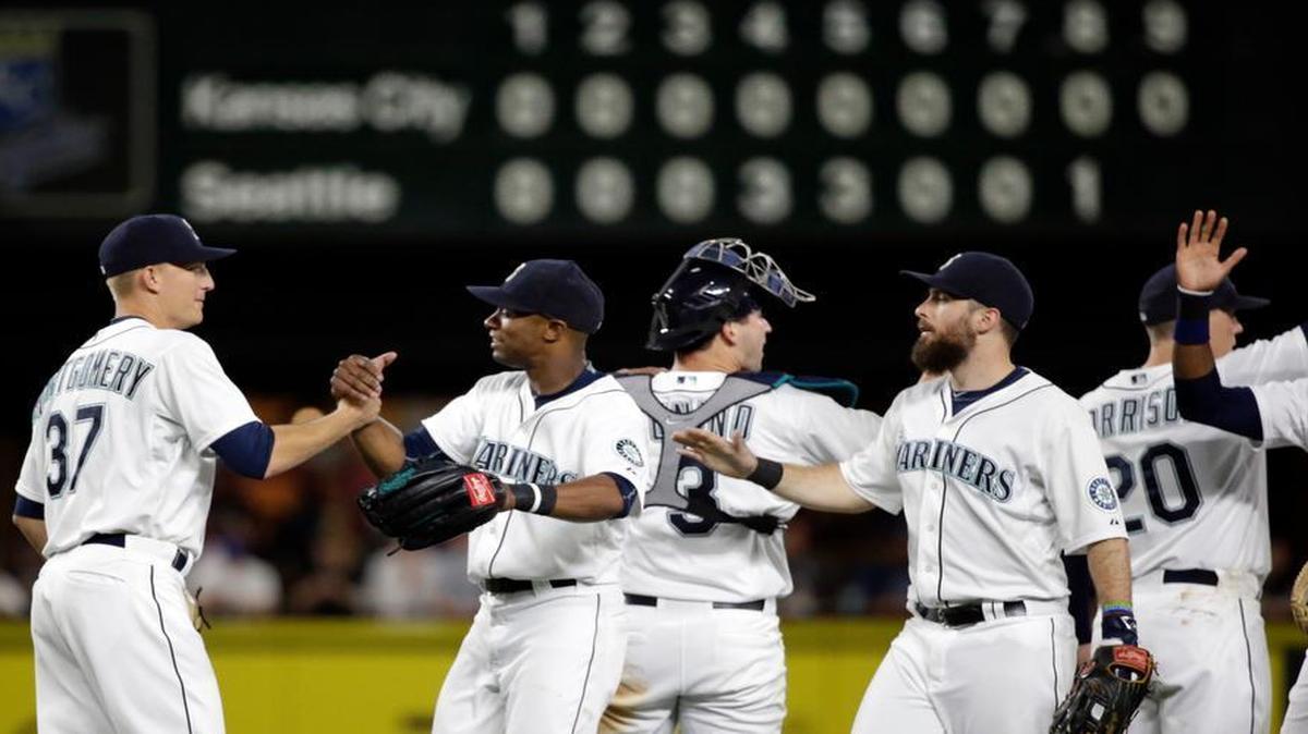 
Mariners starting pitcher Mike Montgomery (left) received congratulations from Austin Jackson and other teammates after Montgomery tossed a 7-0 shutout against the Royals on Tuesday night in Seattle. Montgomery was a prospect in the Royals’ farm system before he was traded to the Tampa Bay Rays in 2013.
