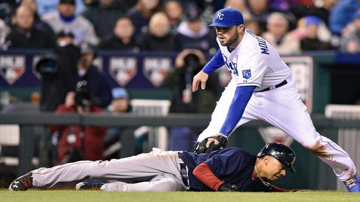 
Royals third baseman Mike Moustakas catches the Red Sox's Mookie Betts (50) in a rundown between home and third to end the top of the fifth inning during Friday's baseball game at Kauffman Stadium.
