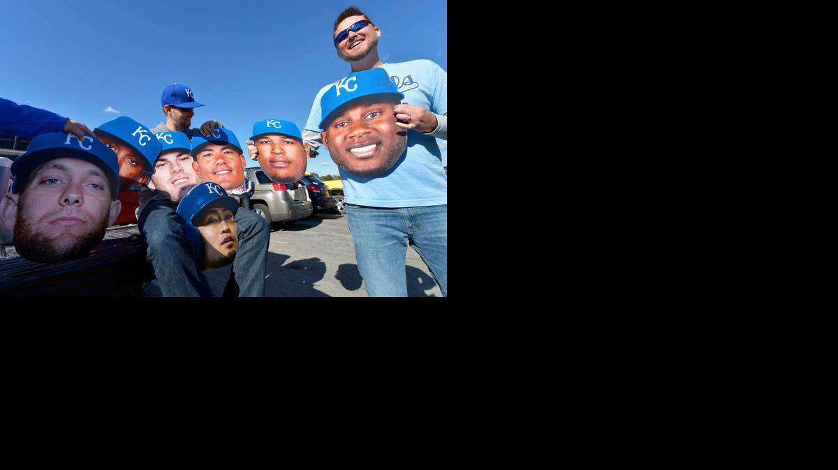 
Tim Svoboda (left) of Lincoln, Neb., and Rob Couton of Fort Worth, Texas, held giant images of Royals players’ heads before heading into Kauffman Stadium on Tuesday to watch Kansas City play the Baltimore Orioles in game three of the American League Championship Series.

