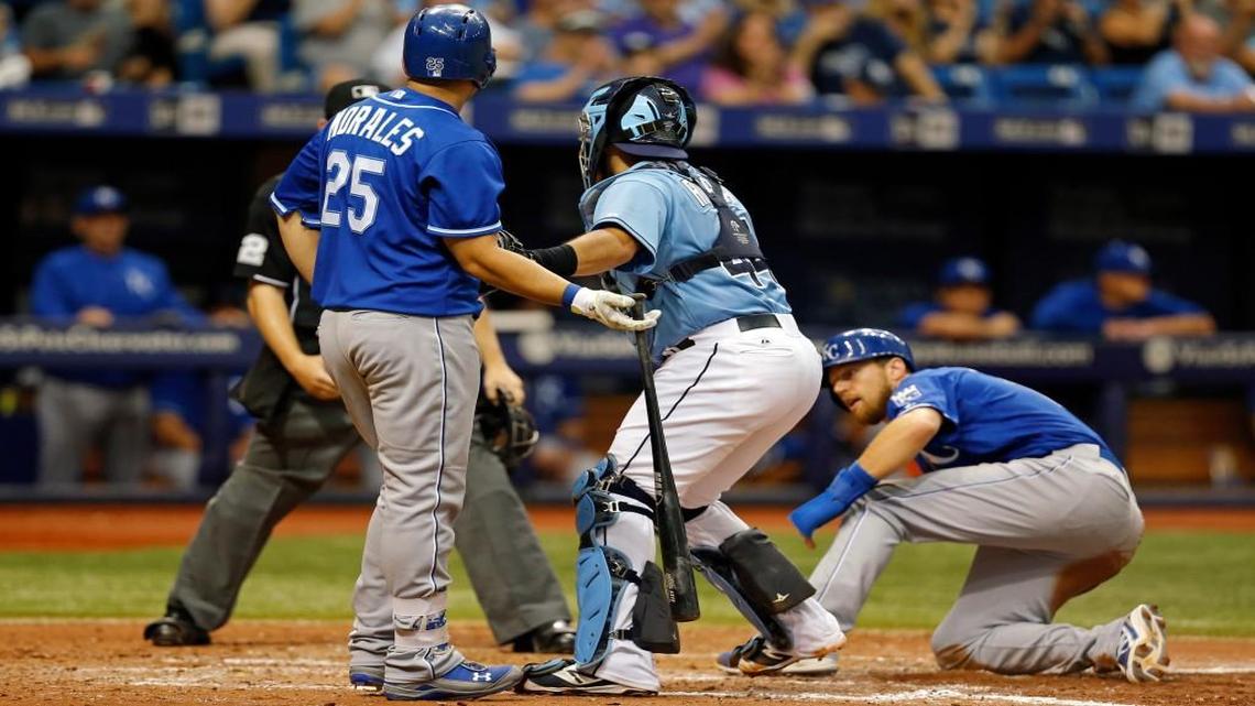 
The Tampa Bay Rays beat the Royals 3-2 on Sunday to deny Kansas City a sweep of the three-game series. The game turned in the eighth inning when the Rays completed a double play as Tampa Bay catcher Rene Rivera (second from right) tagged out Ben Zobrist (right), the potential tying run, then batter Kendrys Morales after Morales hit a groundball down the first-base line that was ruled fair.

