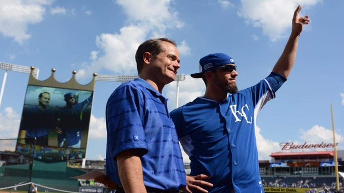 
Royals pitcher James Shields (right) stands next to Royals broadcaster Ryan Lefebvre and waves to fans during the “Take The Crown” rally.

