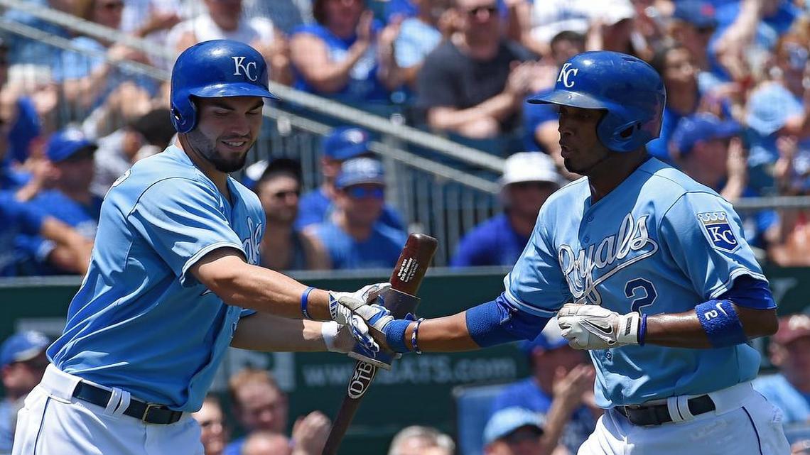 
Alcides Escobar was congratulated by Eric Hosmer after scoring on a ground out by designated hitter Kendrys Morales in the first inning.
