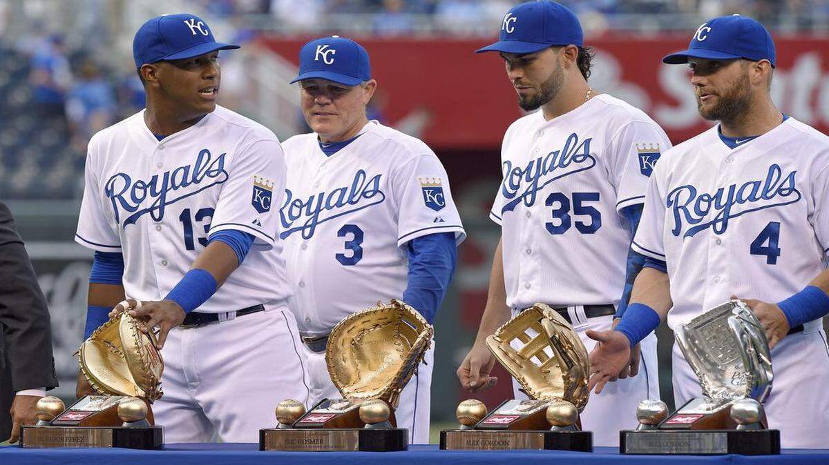 
Kansas City Royals catcher Salvador Perez (from left), manager Ned Yost, first baseman Eric Hosmer and left fielder Alex Gordon were part of a Gold Glove presentation before Friday’s game against the Oakland Athletics at Kauffman Stadium.
