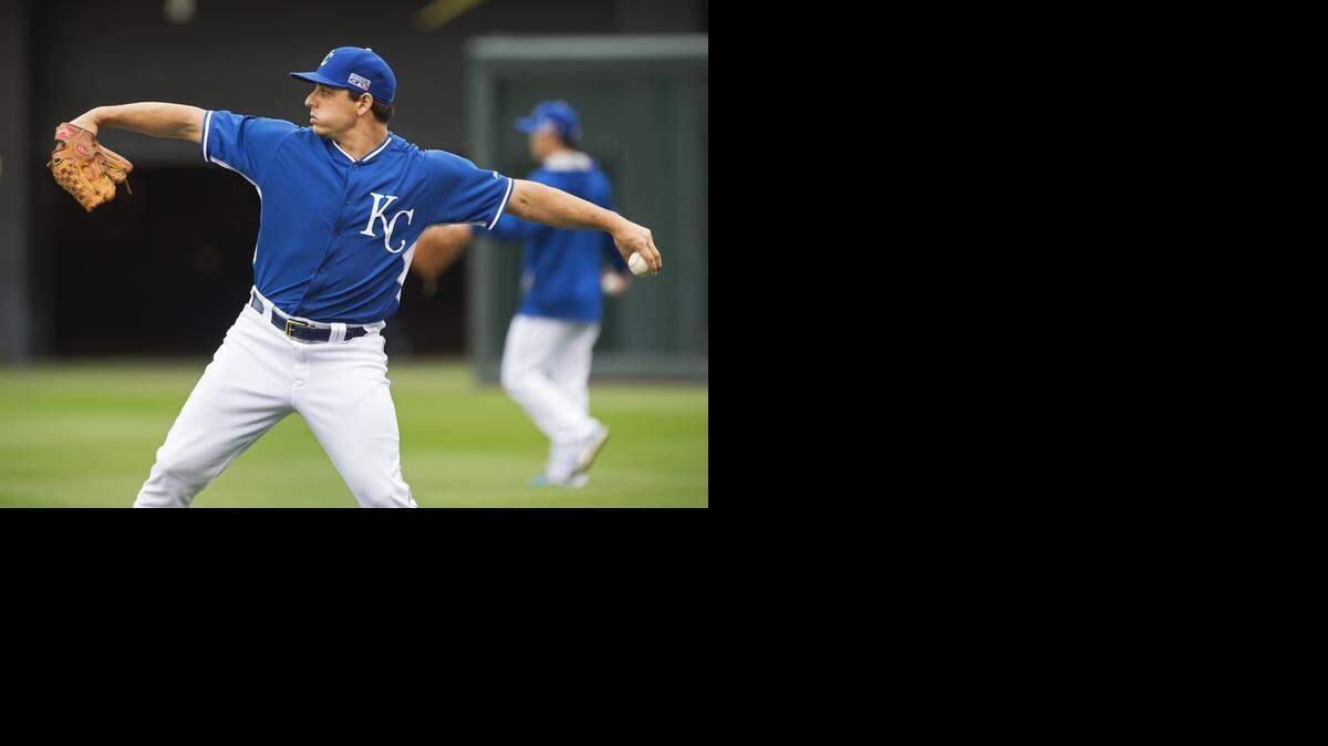 
Pitcher Jason Vargas warmed up his arm during Royals practice Sunday, Oct. 12, 2014 at Kauffman Stadium in Kansas City.
