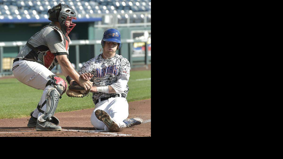 
Dylan Farrell (right) of MidAmeriCare Nationals is tagged out by Regal Plastic catcher Victor Brancato in the first inning of Sunday's Ban Johnson League All-Star Game.
