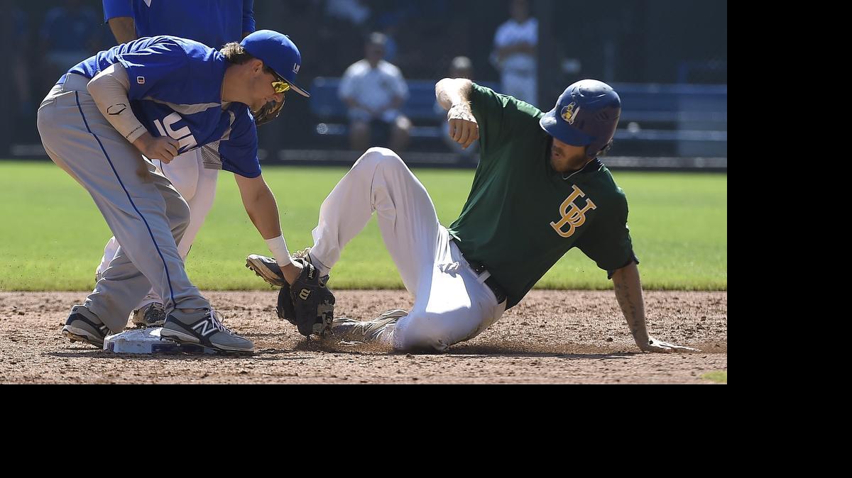 
UMB Bank’s Curtis Boyer tags out Ian Barker of the Midwest Orioles after Barker was looking to stretch an RBI hit into a double in the sixth inning of Sunday’s Ban Johnson Baseball All-Star Game at Kauffman Stadium.
