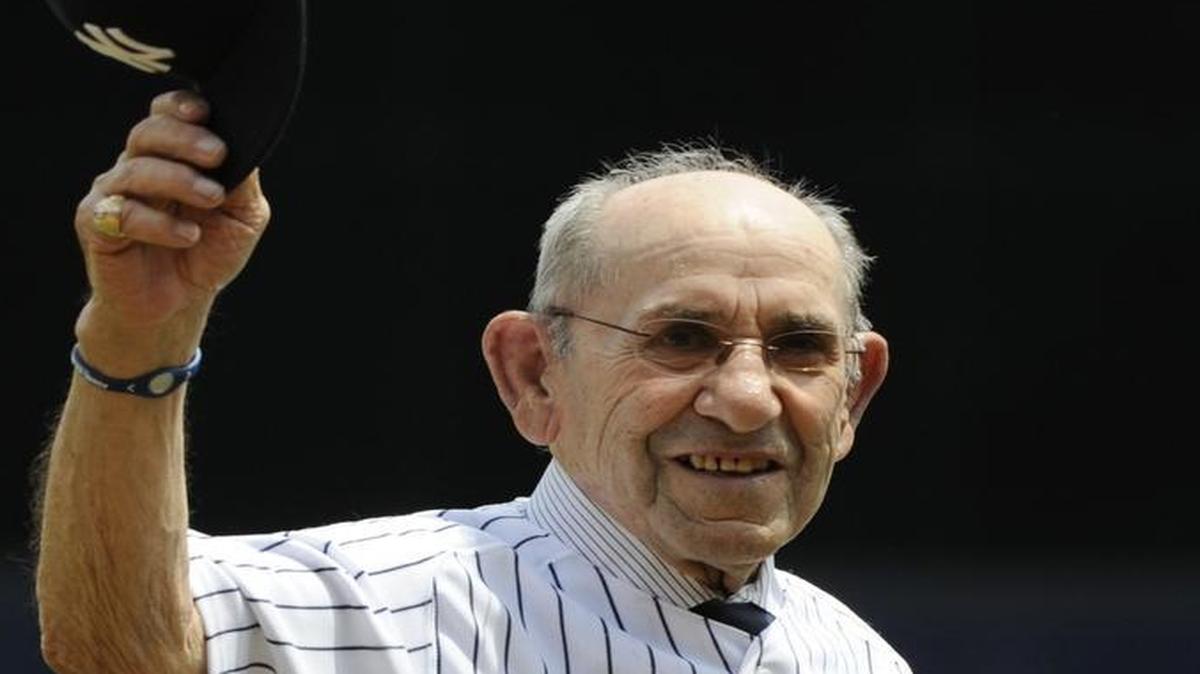 
Yankees great Yogi Berra tipped his cap during Old Timers Day ceremonies in 2011 at Yankee Stadium in New York. Berra died Tuesday at age 90
