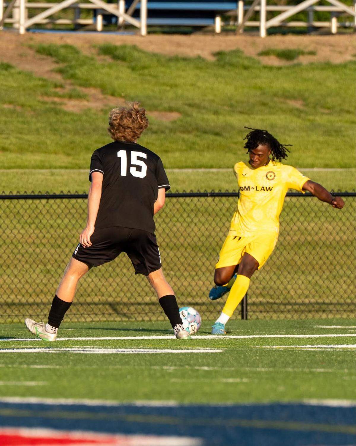 Sunflower State FC defender Cameron Ayoade takes a kick in front of an opposing player. Sunflower is early in its 2026 USL2 season.