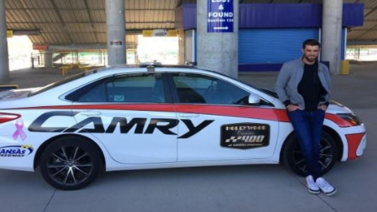 Royals catcher Drew Butera with the pace car.