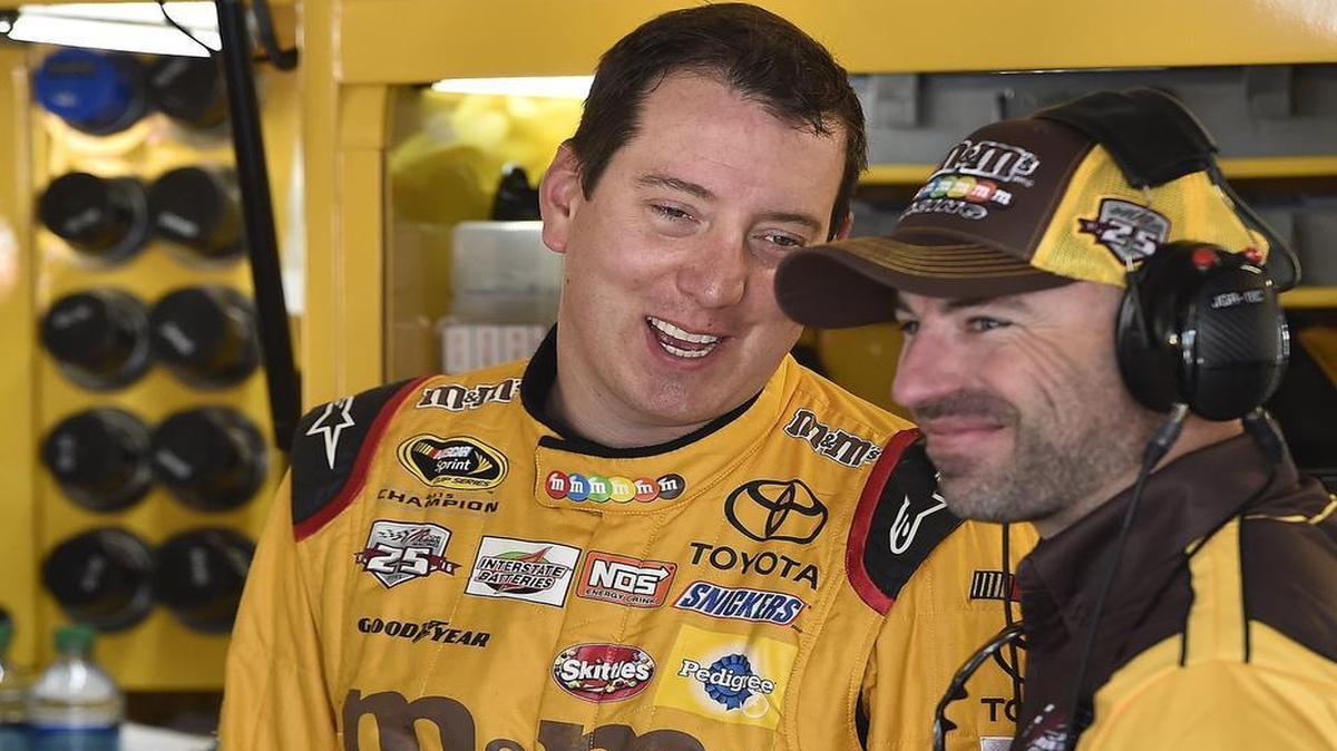 Kyle Busch (left) talks with a crew member during practice on Friday at Kansas Speedway. He has won races at all but three of the 23 tracks on the NASCAR Sprint Cup schedule. He’s yet to win at Kansas Speedway, Charlotte Motor Speedway and Pocono Raceway.