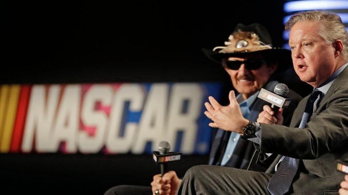 NASCAR Chairman and CEO Brian France (right) described new charter system for team owners at a news conference Tuesday in Charlotte, N.C. With him was team owner Richard Petty.