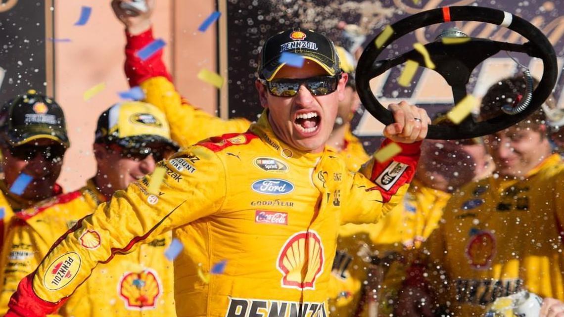 
Joey Logano celebrated in Victory Lane after winning the NASCAR Sprint Cup Series Hollywood Casino 400 on Sunday at Kansas Speedway.

