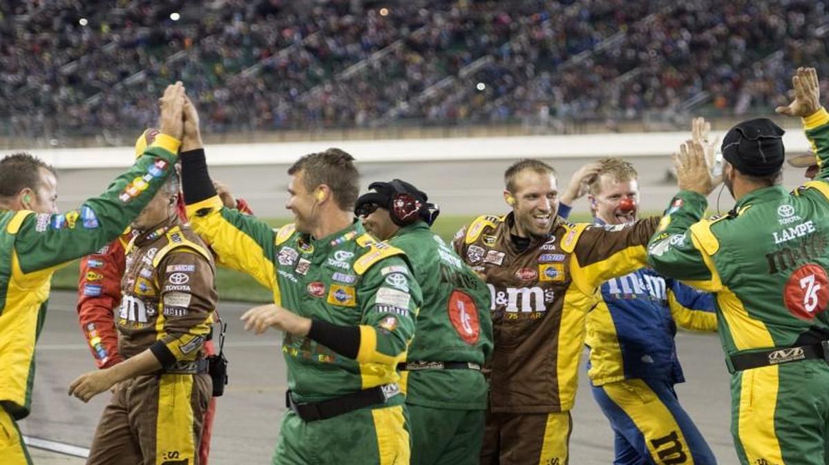 Kyle Busch’s crew celebrated after Busch crossed the finish line to win the Go Bowling 400 NASCAR Sprint Cup Series at the Kansas Speedway, Saturday, May 7, 2016.