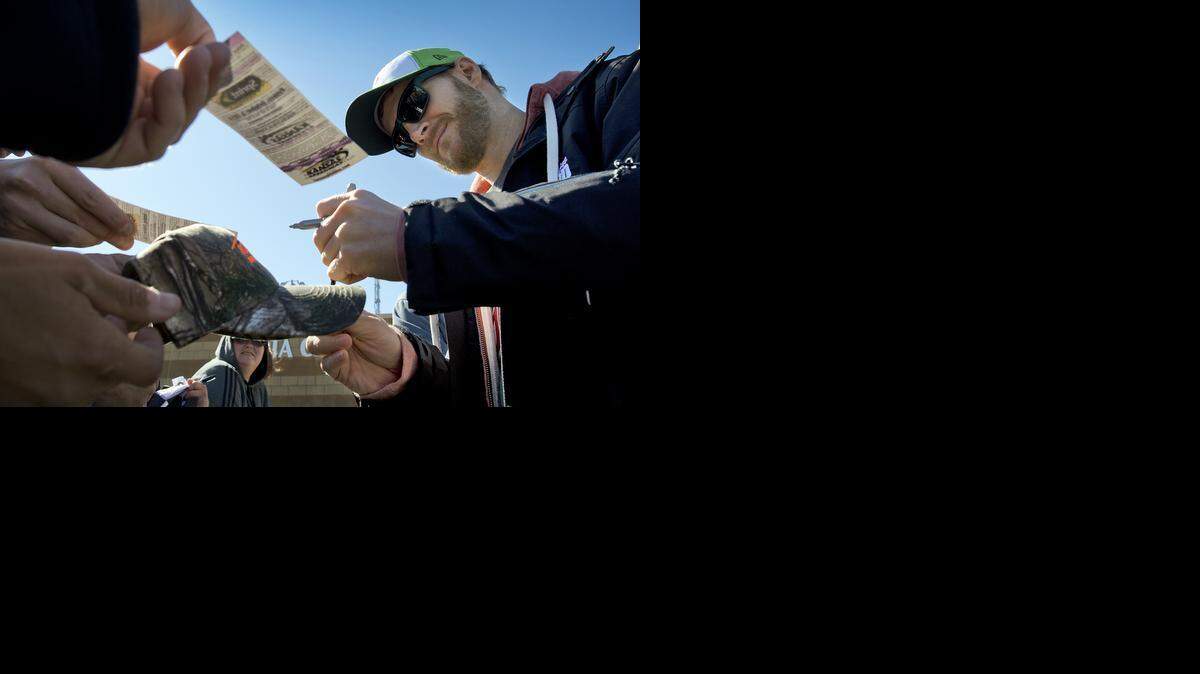 
Dale Earnhardt Jr. is at the Kansas Speedway for the 14th annual Hollywood Casino 400. He signed autographs for fans before practice on Friday.
