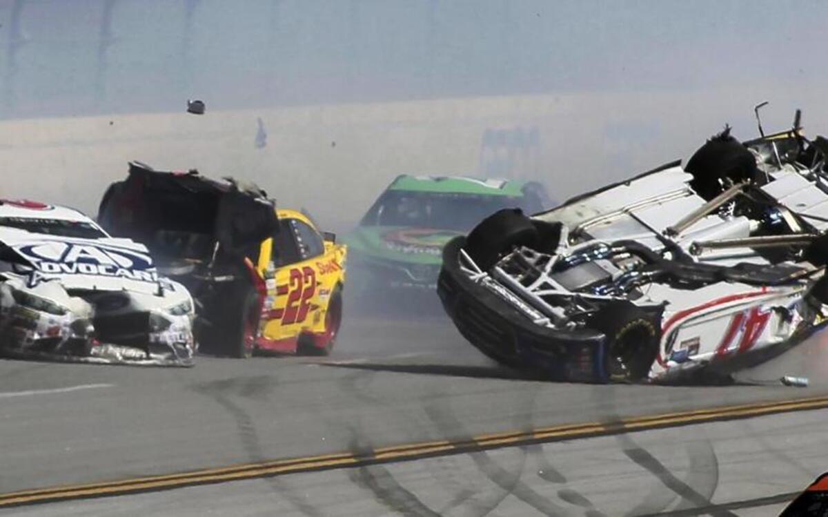 AJ Allmendinger flipped on the backstretch in a crash involving multiple drivers, including Trevor Bayne (6) and Joey Logano (22), in Sunday’s race at Talladega Superspeedway.